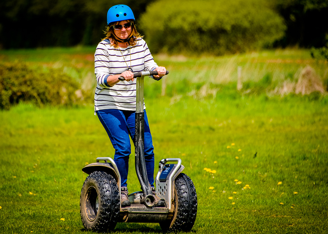 A lady riding a segway