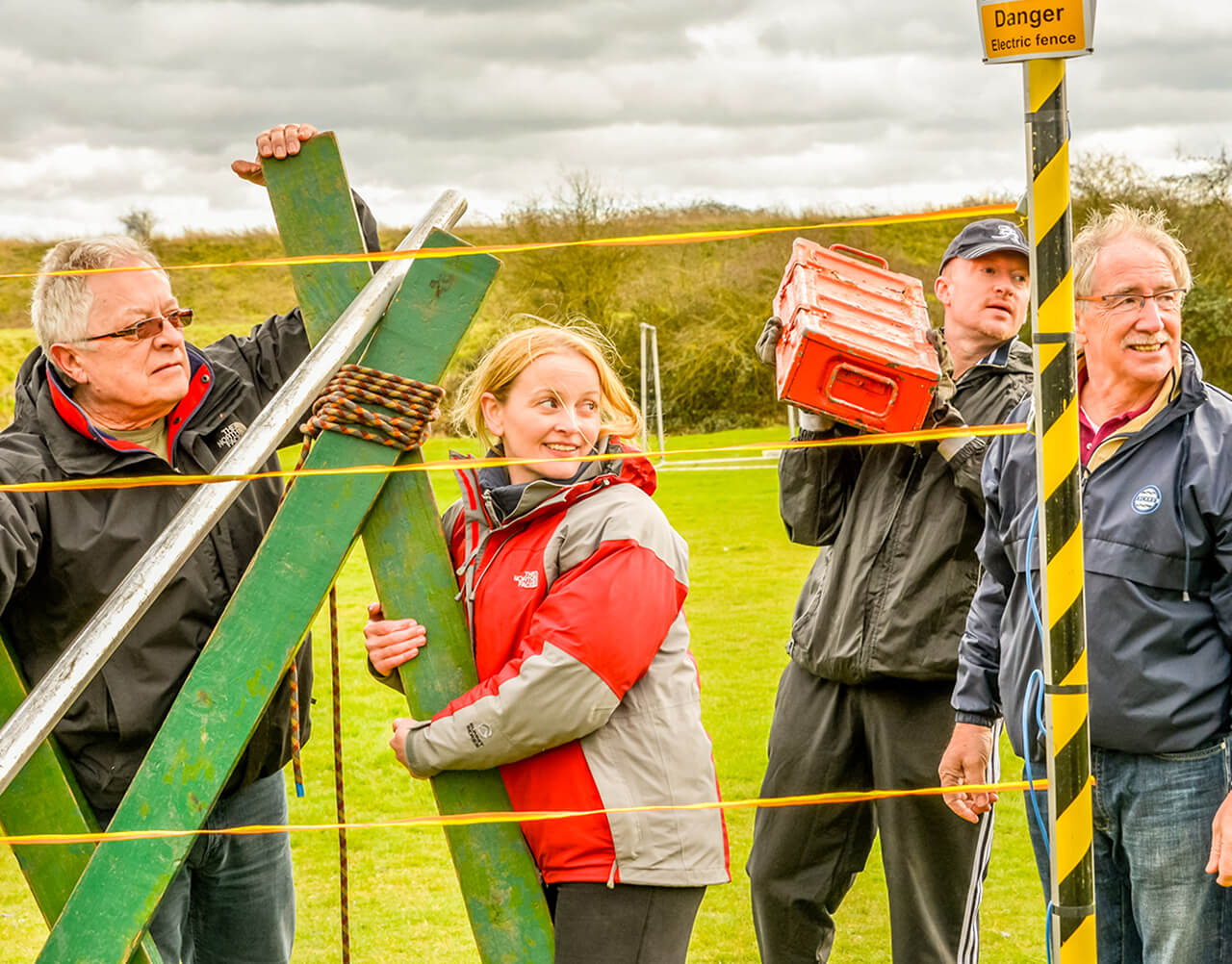 A group trying to build an electric fence